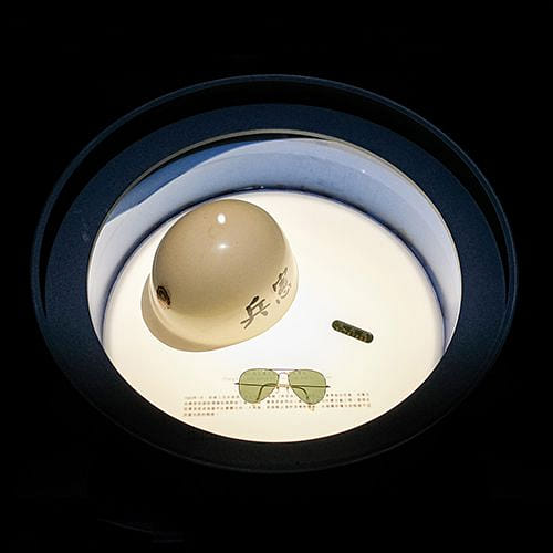 Chang’s military police hat, name tag, and sunglasses