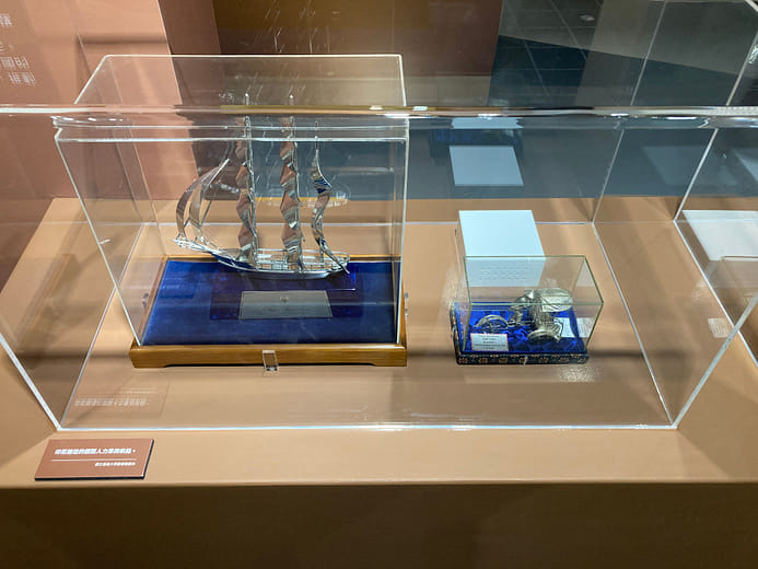 Silver rickshaw and masted sailing ship models presented by Indonesia